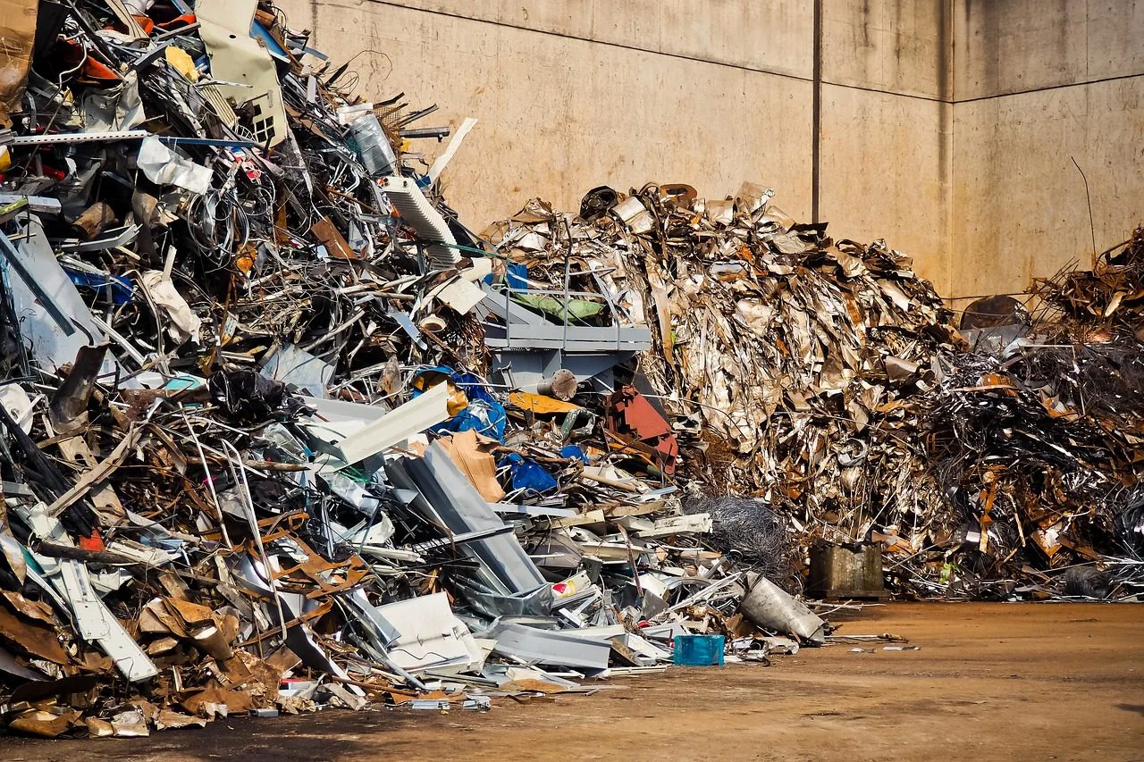 piles of scrap metal in a yard.
