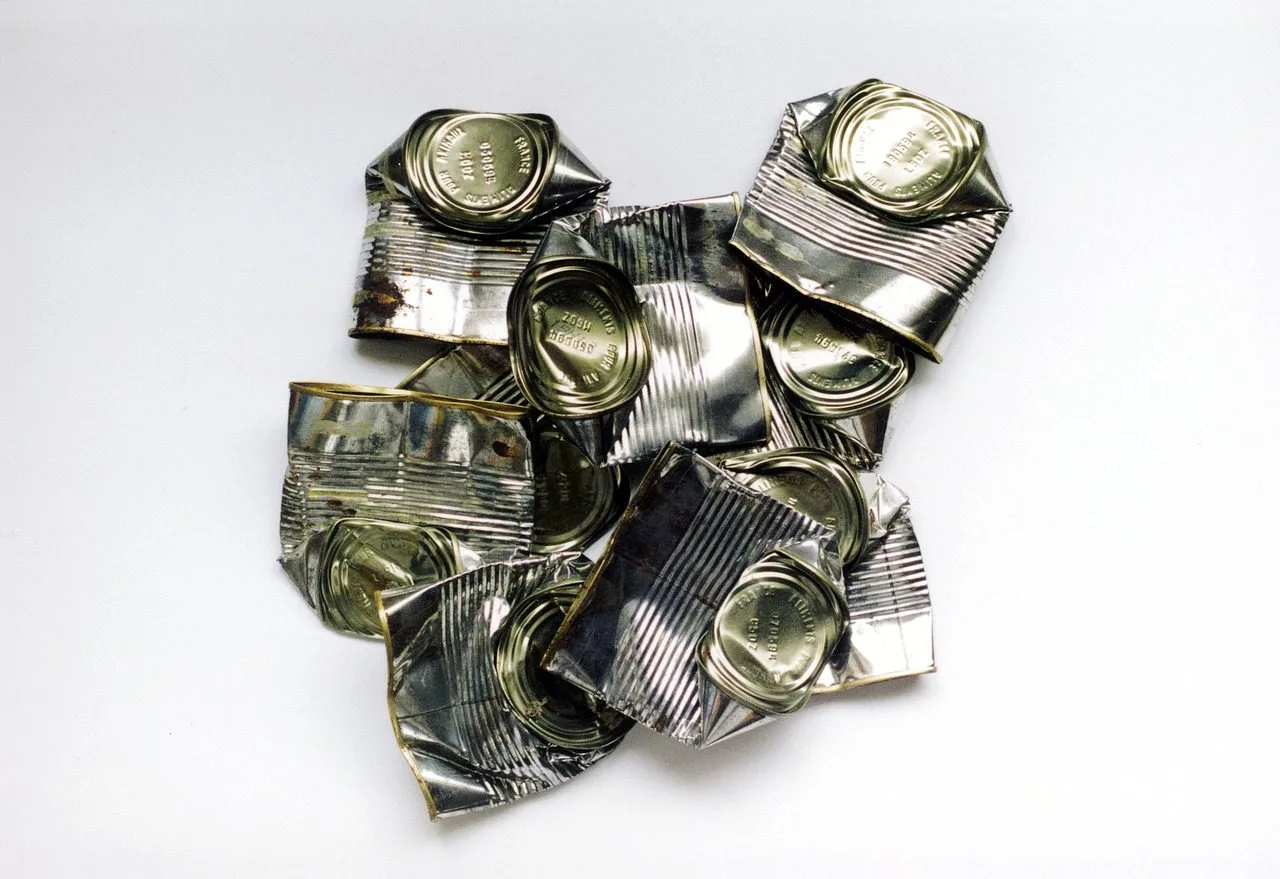 crushed metal food tins.