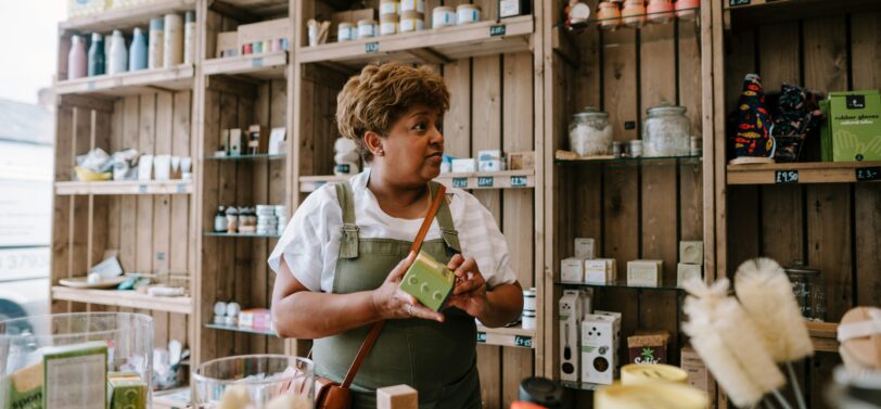 woman working in a zero waste shop.